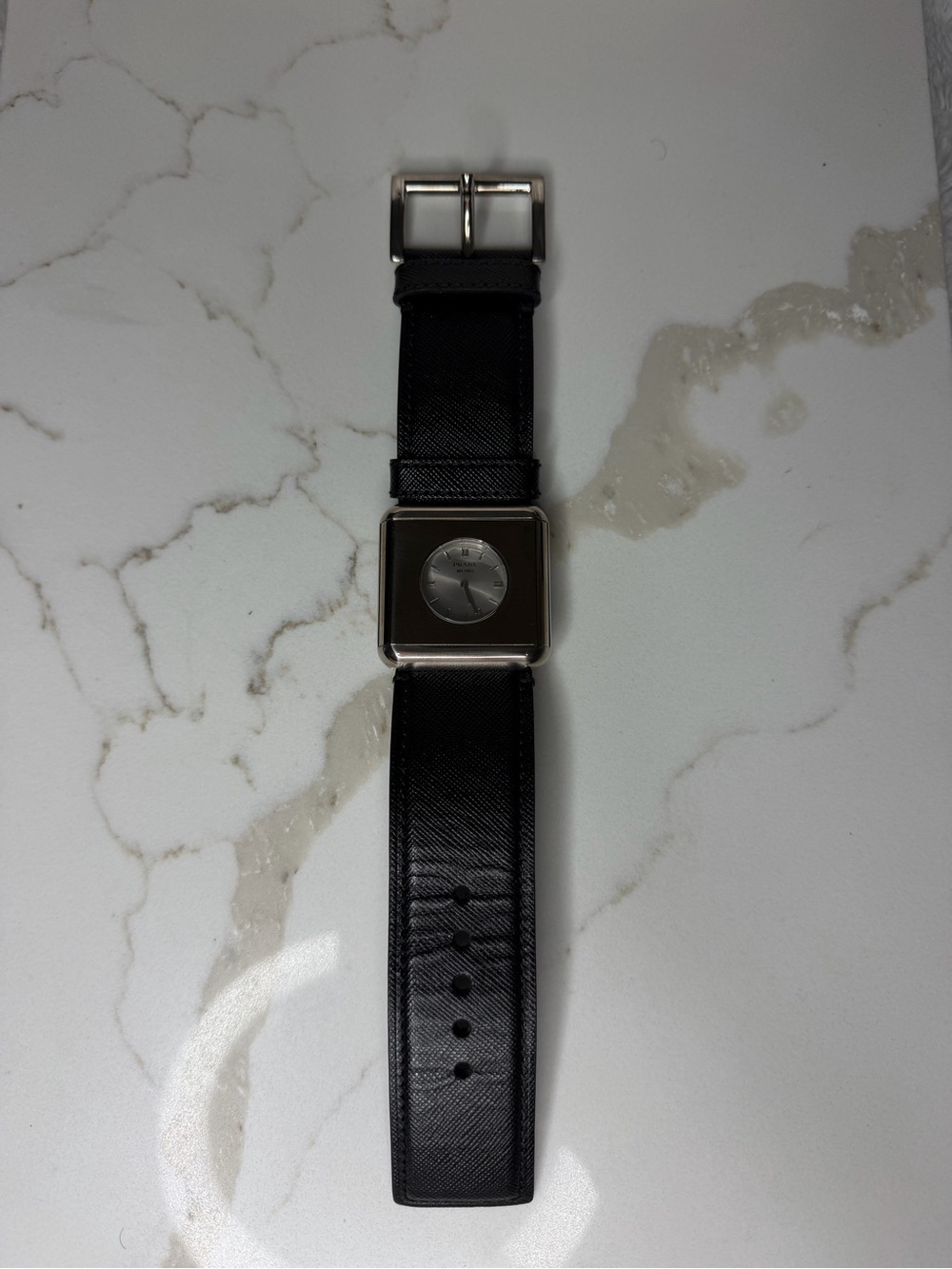 Prada Woman’s Black Leather Square Face Watch with Silver Dial